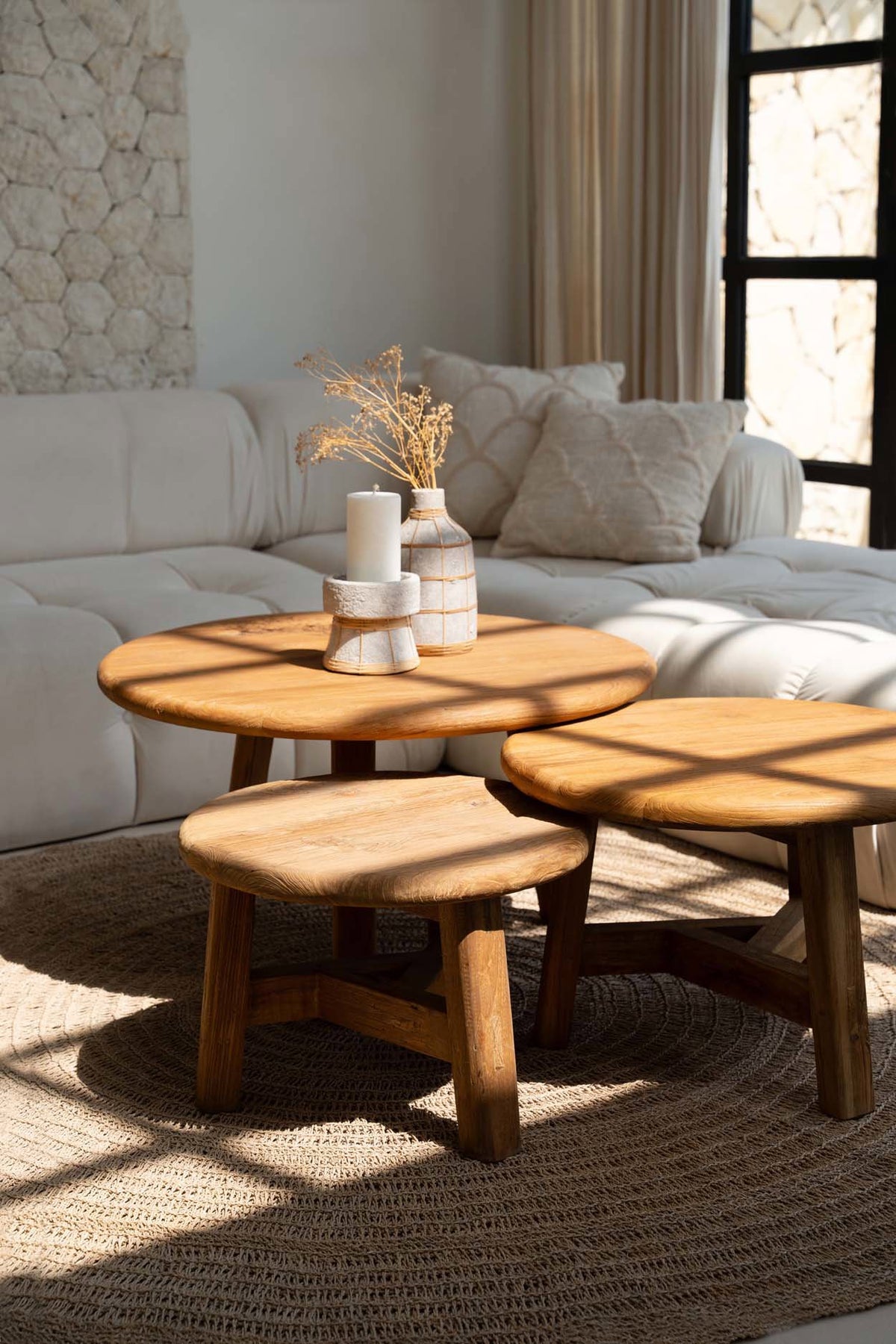 Wooden coffee table with decorative items in a living room setting