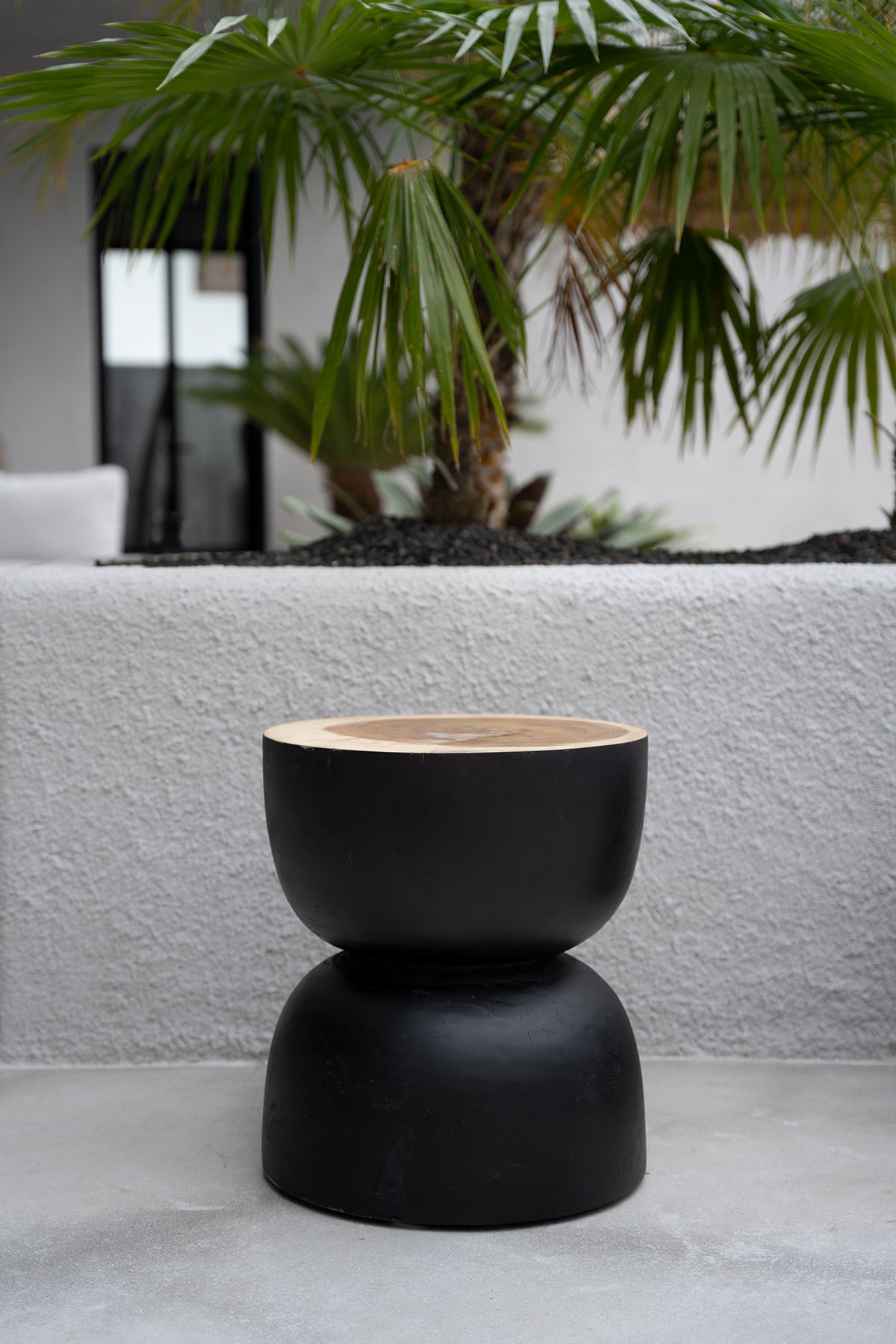 The karbun table black natural wood round side table flo & joe
