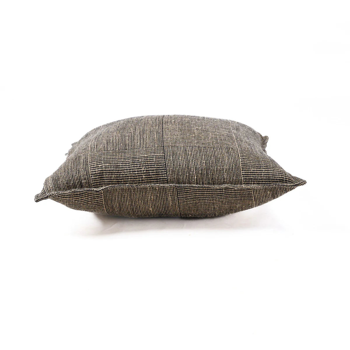 Textured tweed cushion pillow on a white background