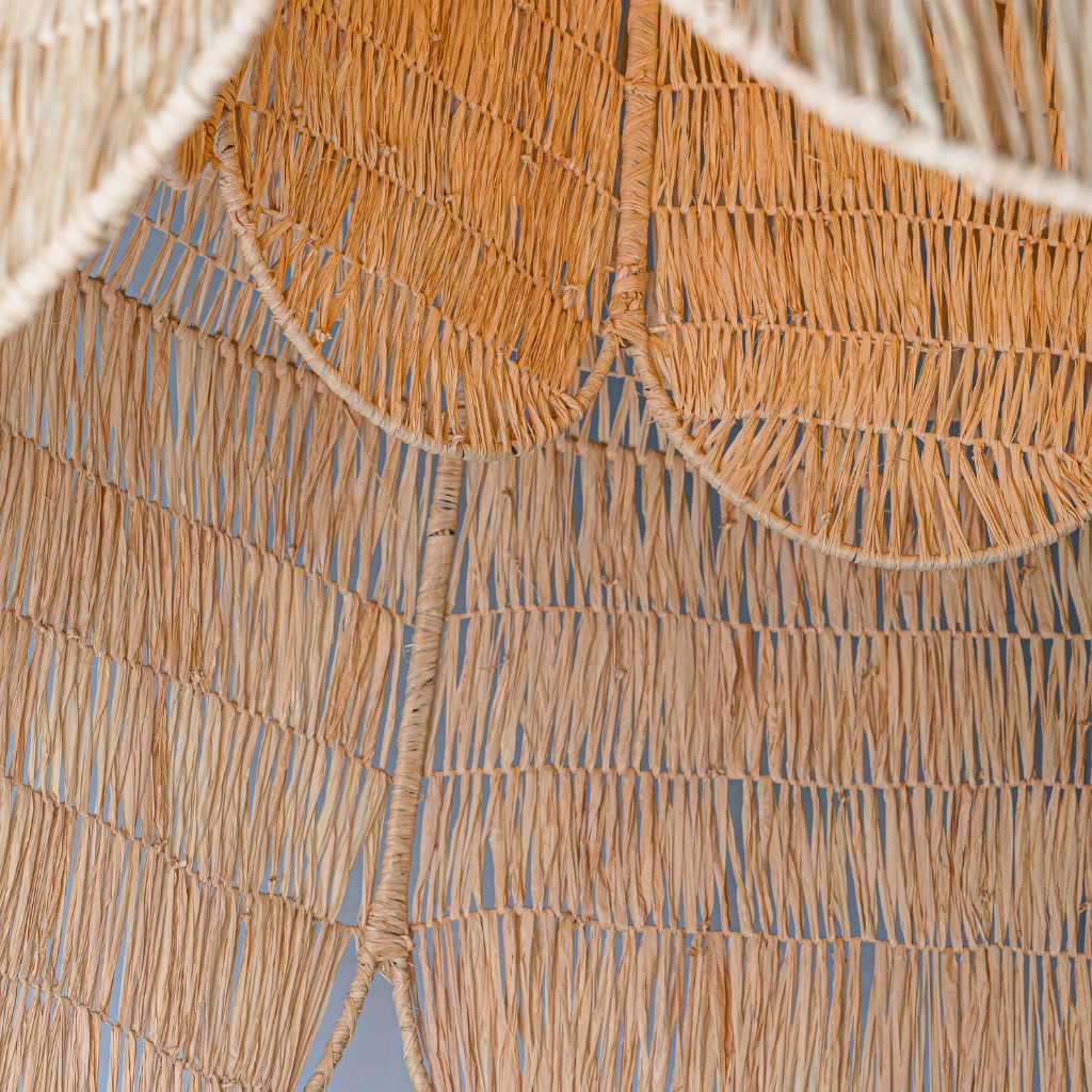 Close up of arattan chandelier in a domed rounded petal shape