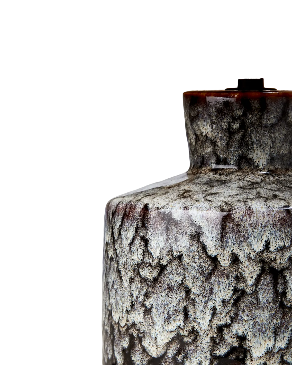 Close up of a textured ceramic lamp with a rattan shade on a white background