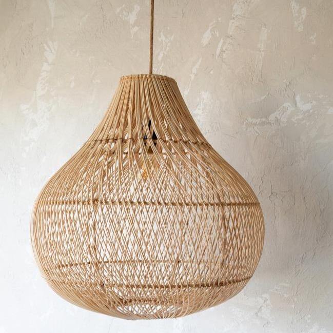 Woven bottle rattan pendant light shade on neutral background