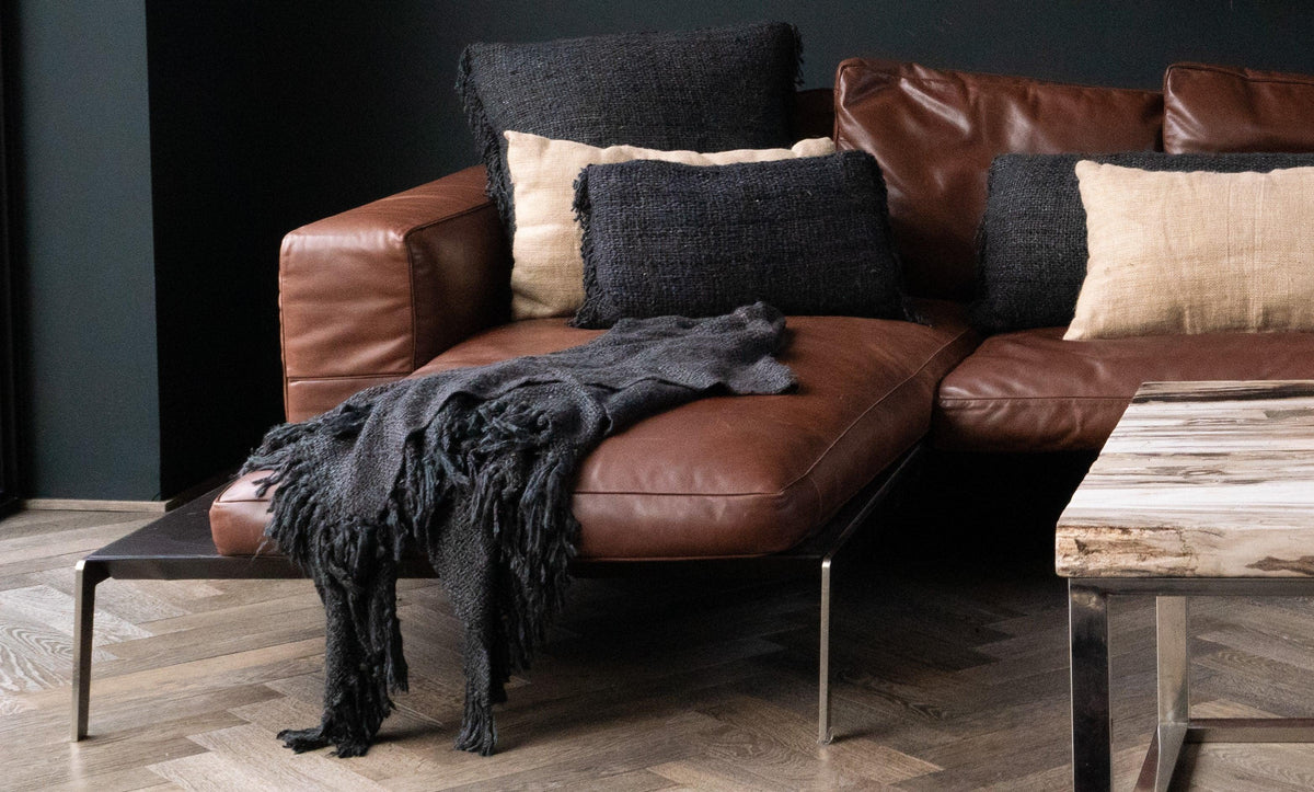 Luxurious black navy throw on beige sofa flo & joe