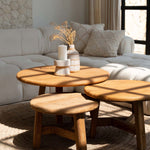 Wooden coffee table with decorative items in a living room setting
