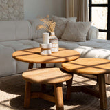 Wooden coffee table with decorative items in a living room setting