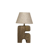 Table lamp with a unique wooden base and beige lampshade on a white background