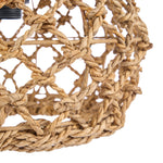 Close-up of a woven rope light fixture on a white background