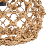 Close-up of a woven rope light fixture on a white background