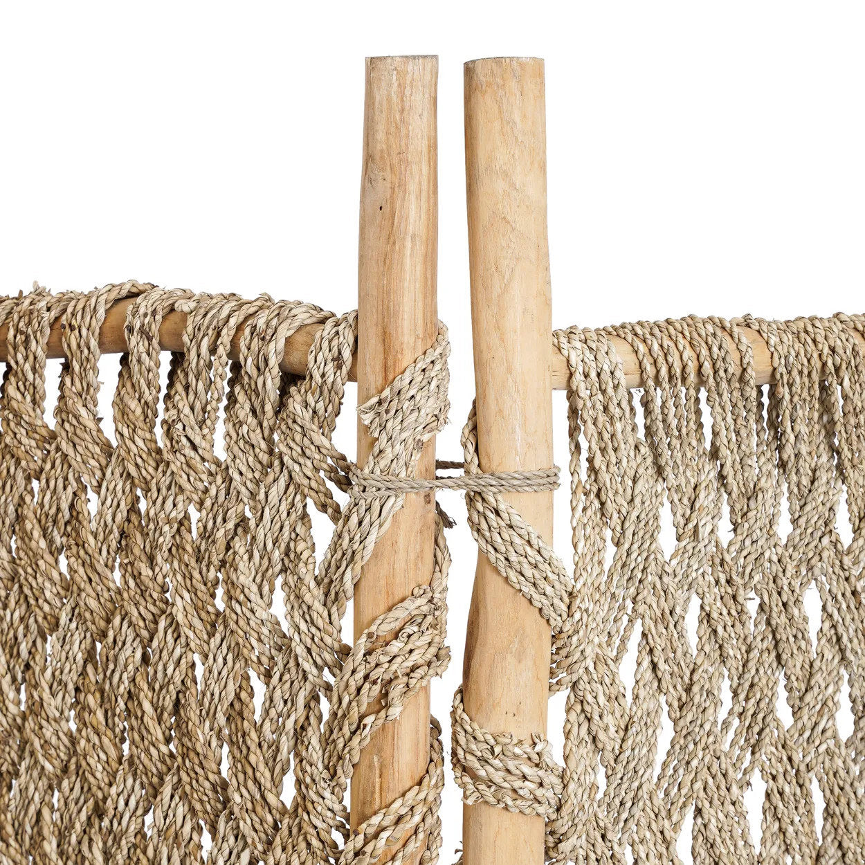 Close-up of a woven room divider screen with wooden sticks on a white background