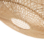 Close-up of a woven rattan wicker light shade  on a white background
