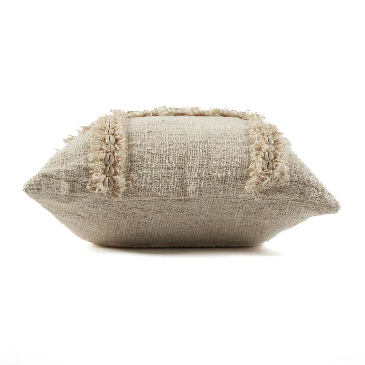 Textured beige pillow with decorative trim on a white background