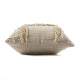 Textured beige pillow with decorative trim on a white background