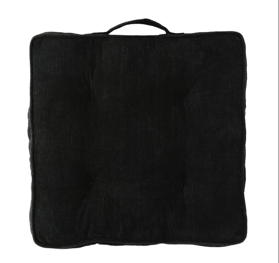 Black corduroy cushion with a handle 