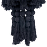Black tassel and pom-pom wall pendant light on a white background