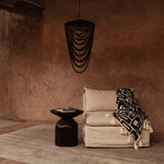 Black beaded chandelier in a wabi sabi warm living room