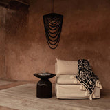 Black beaded chandelier in a wabi sabi warm living room