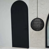 Black door and hanging round dark rattan black lamp shade
