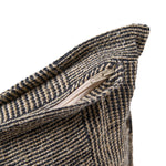 Close-up of a textured fabric with a zipper on a white background