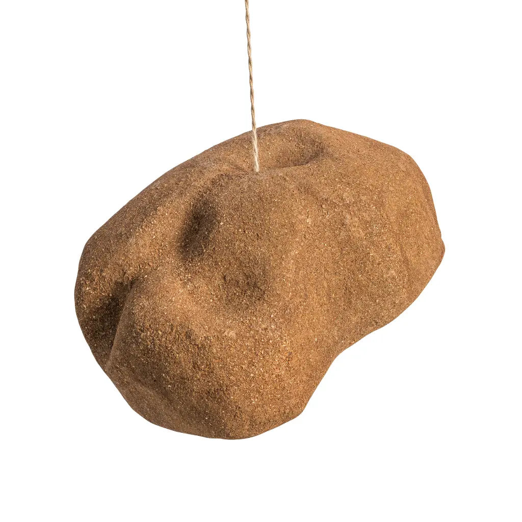 A brown textured hanging pendant light shade shaped like a rough stone, suspended by a thin string against a plain white background.