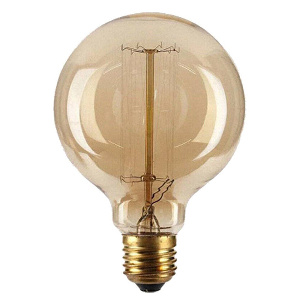 A classic round led light bulb with a warm amber-tinted glass envelope and a brass screw base, shown against a solid white background.