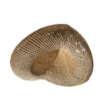 Heart-shaped woven wicker light shade on a white background