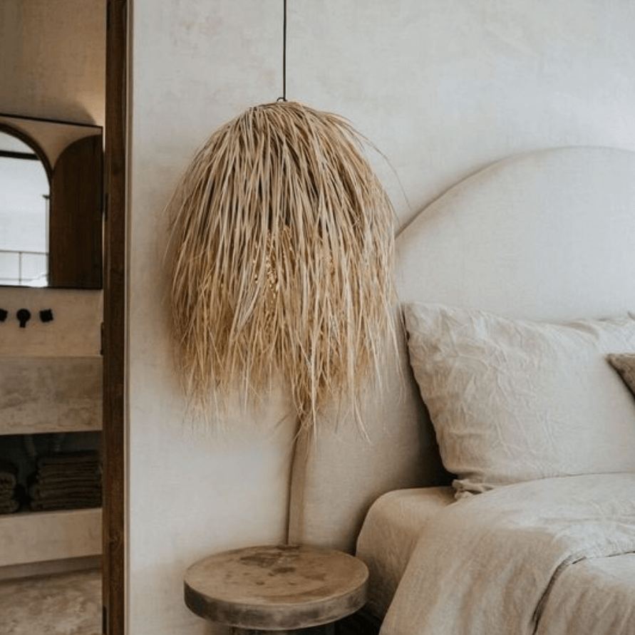 Large natural rattan shaggy pendant light. Perfect for bedroom interiors, dining rooms or living areas. Shop Flo & Joe UK.