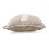 Textured natural linen cushion with a white centre on a white background