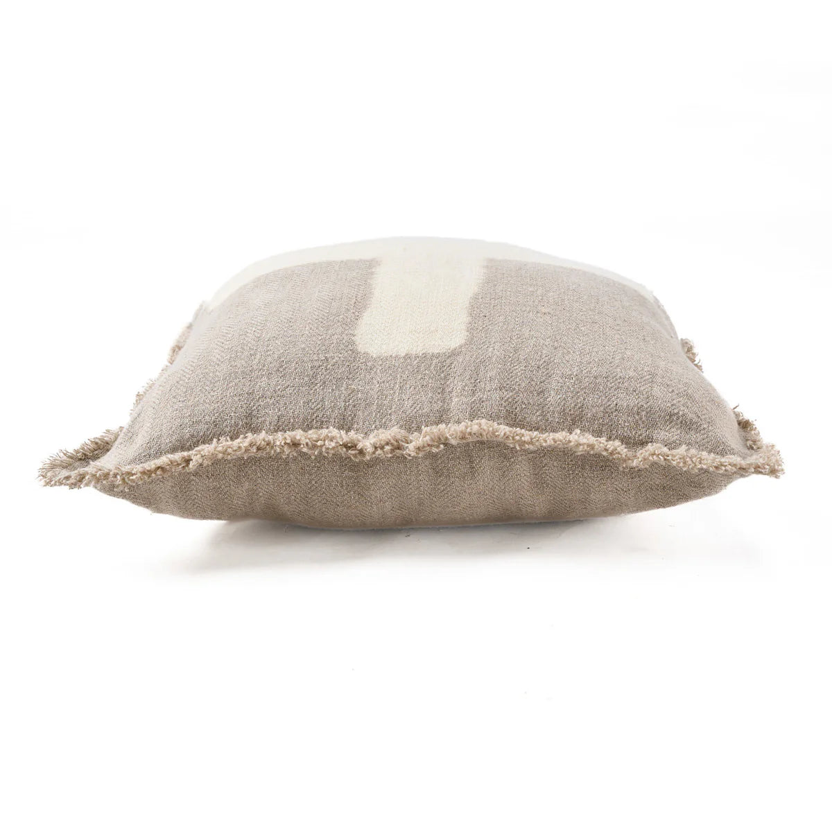Textured natural linen cushion with a white centre on a white background