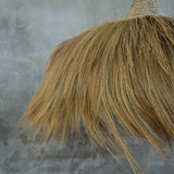 extra large pendant light shade with natural fibres and rattan  against a textured wall