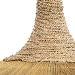 Close-up of a natural lightshade with a woven handle and bristle head on a white background
