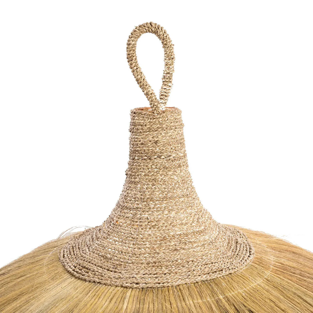 Close up of a natural rattan light shade with a woven handle on a white background