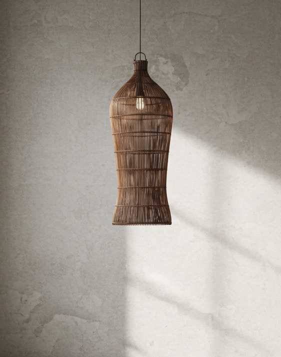 Rattan pendant light hanging in a room with a textured wall and window.