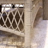 Close-up Wicker rattan  wheeled sun lounger chair frame
