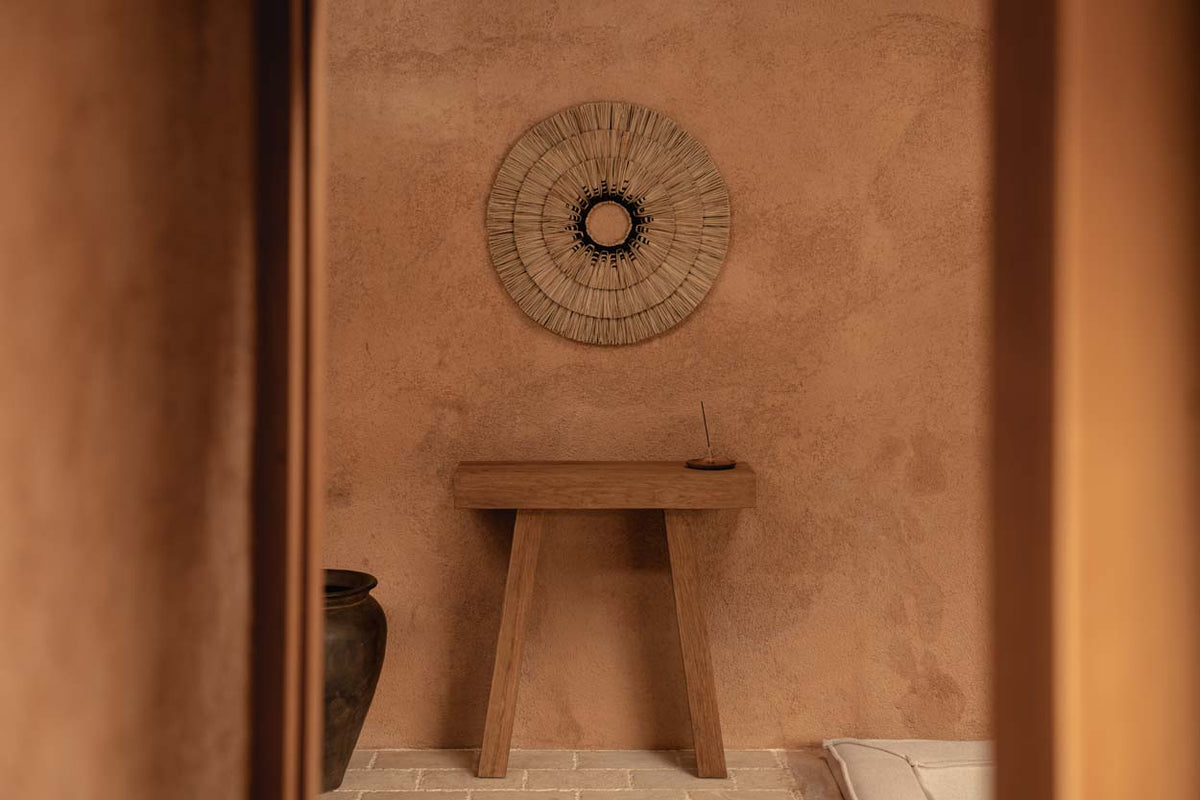 Teak wood console table, earthy room colour trend with wall hanging
