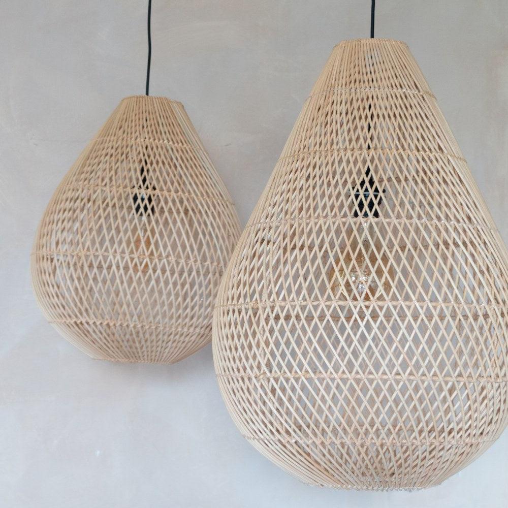 A large natural rattan pendant light in teardrop shape hanging with a smaller one  flo & joe