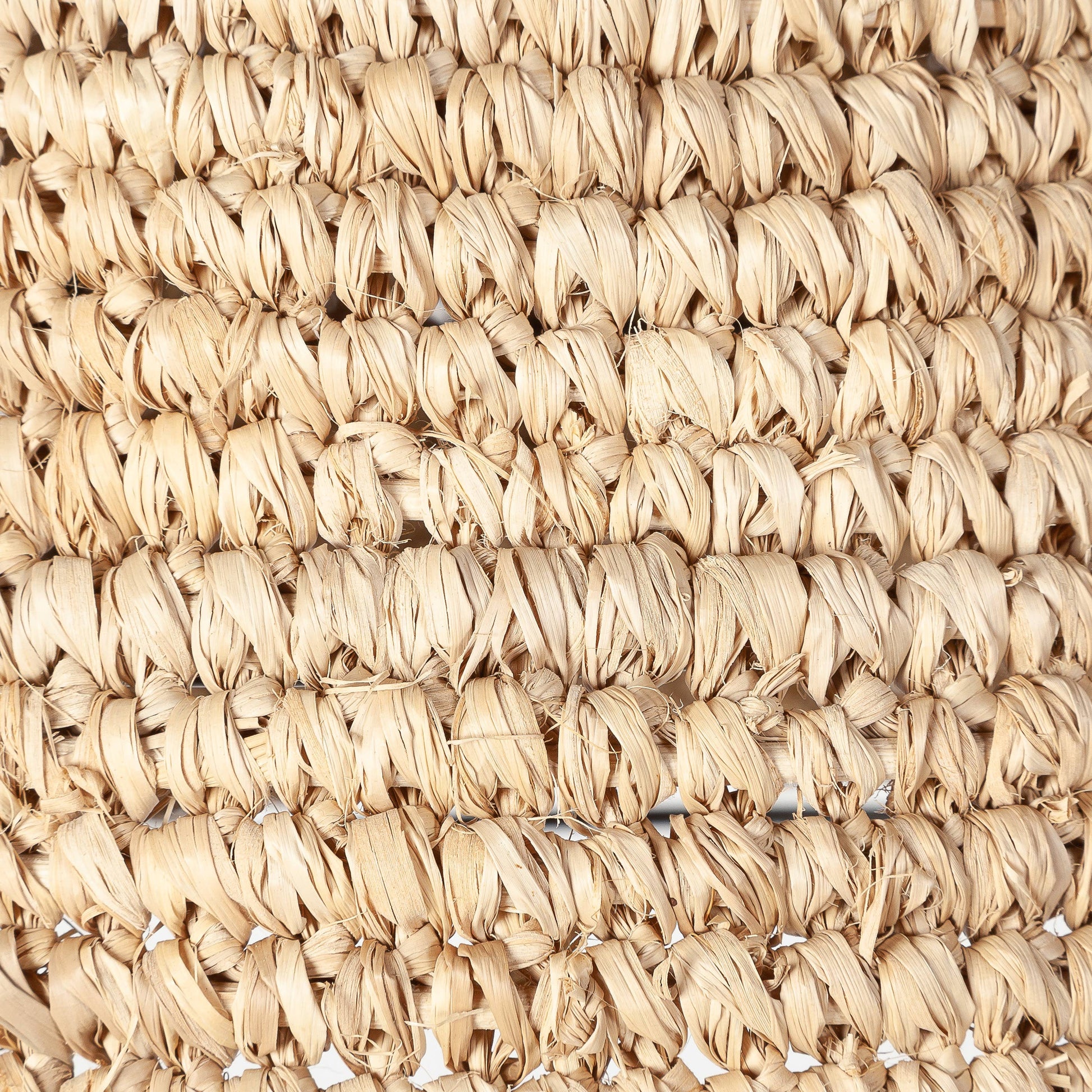 A large dome natural raffia rattan large light shade hanging in a living room - UK