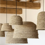 A collection of natural woven seagrass rattan ceiling light shades in sizes small medium and large
