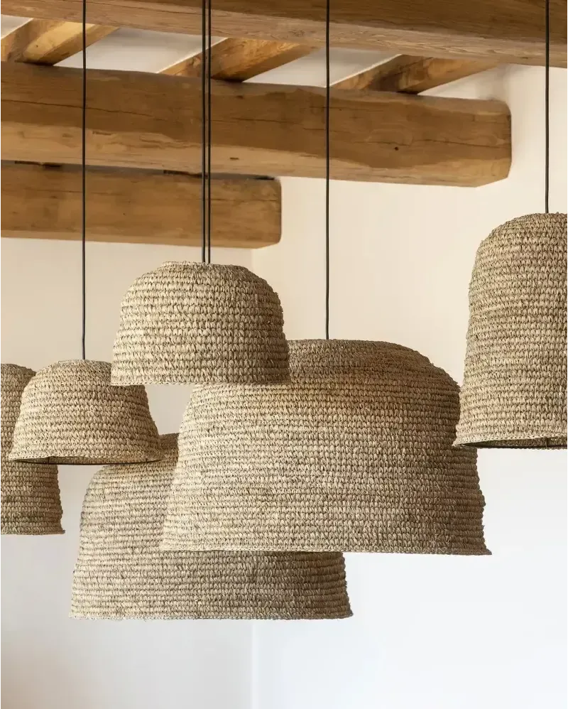 A collection of natural woven seagrass rattan ceiling light shades in sizes small medium and large