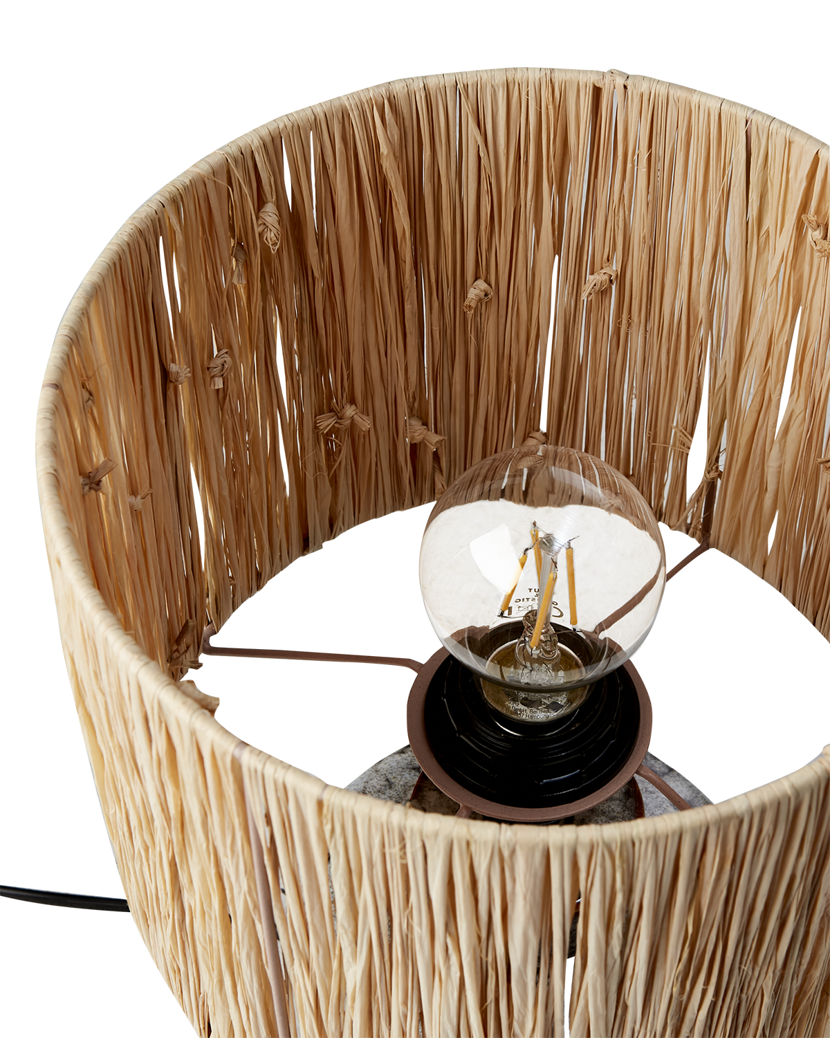 Rattan lampshade with a light bulb inside on a white background