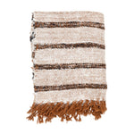 Textured blanket with brown and beige stripes on a beige background