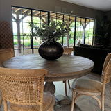 classic round wooden dining table with carved base, seats 4 and is 120cm in diameter