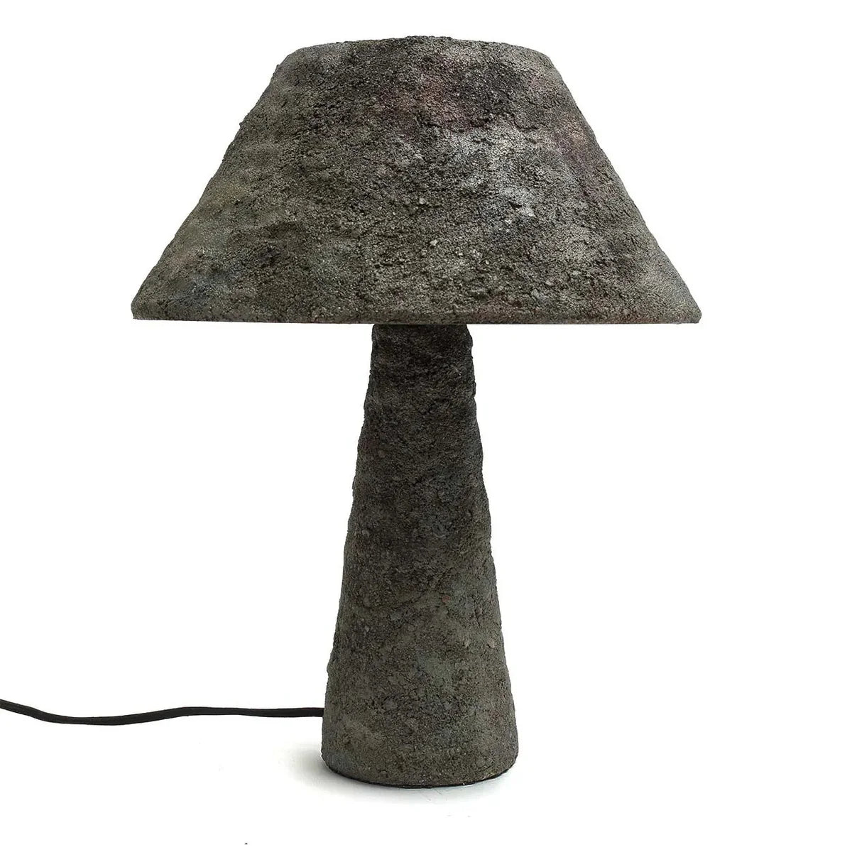 Concrete table lamp with a textured design on a white background