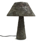 Concrete table lamp with a textured design on a white background