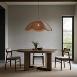 extra large Rattan ceiling light in Dining room with a round wooden table and chairs