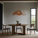 extra large Rattan ceiling light in Dining room with a round wooden table and chairs