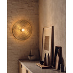 Large round brass Wall light plate with warm white bulb in dining room