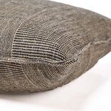 Textured brown cushion on a white background