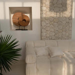 modern modular cream sofa with wall panels and cream scatter cushions