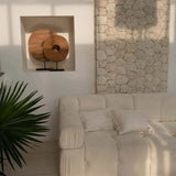 modern modular cream sofa with wall panels and cream scatter cushions