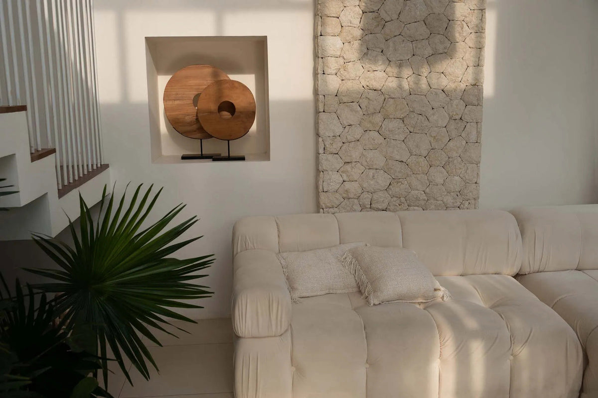 Modern modular cream sofa with wall panels and cream scatter cushions